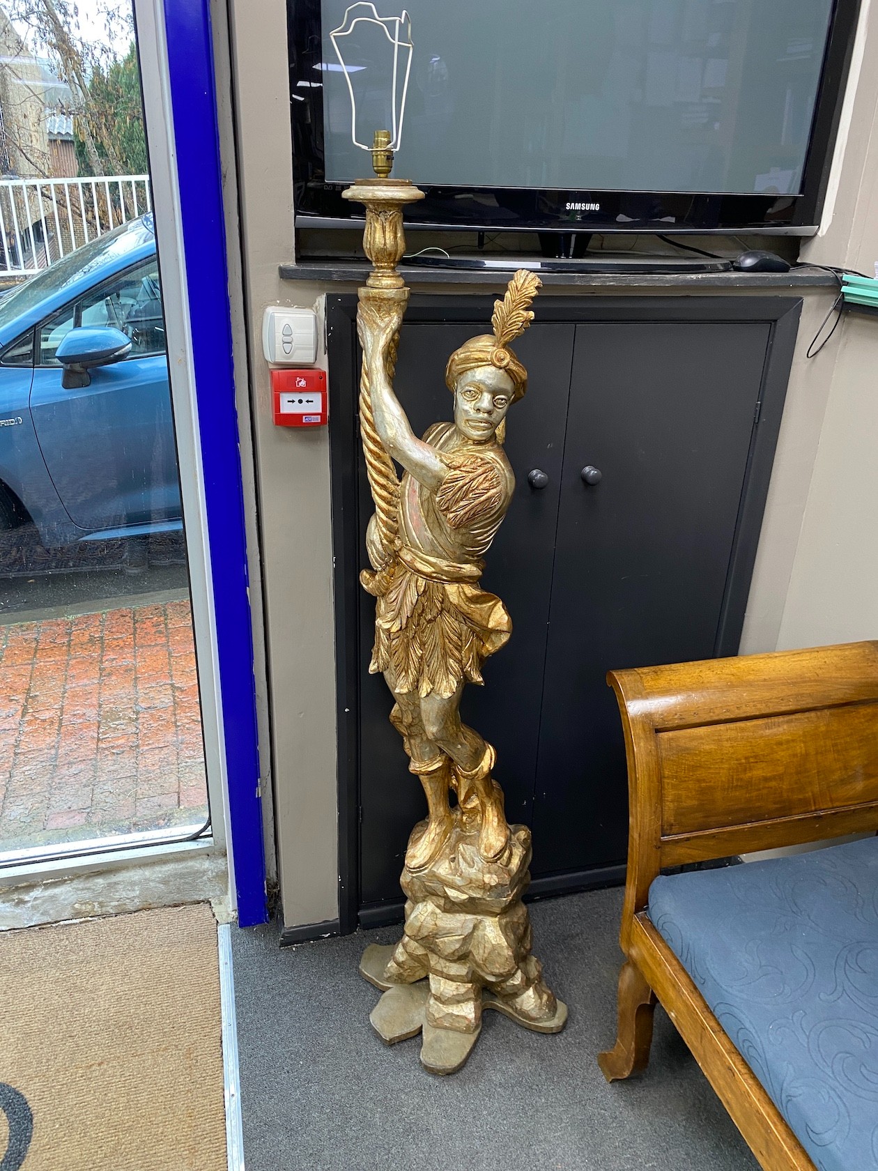 A pair of Italian style silvered and parcel gilt Blackamoor floor lamps, height 159cm
